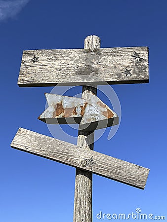 blank old wooden sign board with rusty arrow Stock Photo