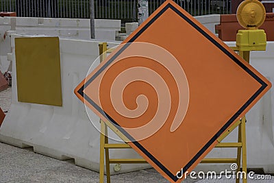 Blank orange diamond-shaped construction warming sign Stock Photo