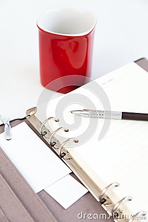 Blank page diary pencil and red cup Stock Photo