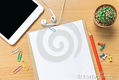 Blank paper, color pencil, and smart phone on wood desk Stock Photo