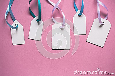 Blank paper price sale tags On pink background Stock Photo