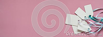 Blank paper price sale tags On pink background. Banner format Stock Photo