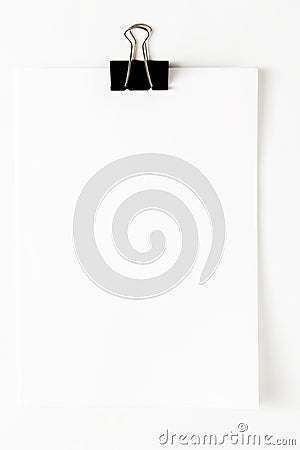 Blank paper sheet attached with clip isolated on white background Stock Photo