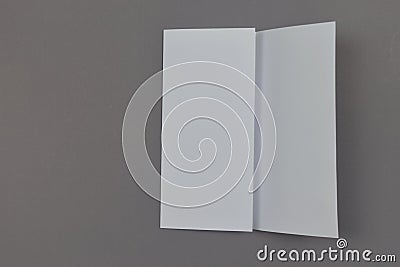 Blank paper sheets on grey background. Stock Photo