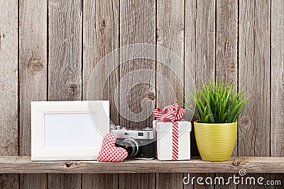 Blank photo frame, heart, camera and plant Stock Photo