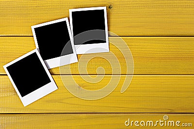 Polaroid frame photo prints wood table background copy space Stock Photo