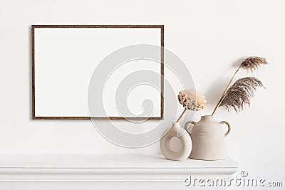 Blank picture frame mockup in home interior design. Living room, commode with vases. Stock Photo