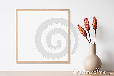 Blank picture frame mockup on white wall, template for square artwork. View of modern minimal style interior with canvas Stock Photo