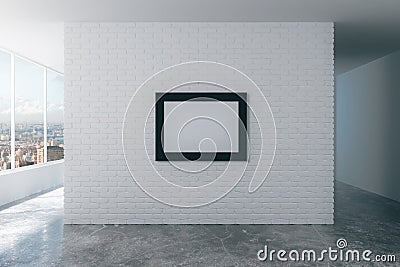 Blank picture frame on white brick wall in empty loft room, mock Stock Photo