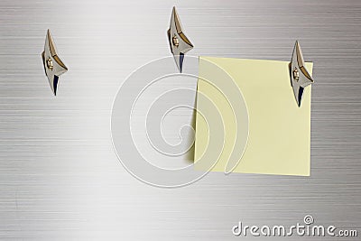 Blank piece of paper attached on a glossy aluminum surface with Japanese ninja concealed weapons. Stock Photo