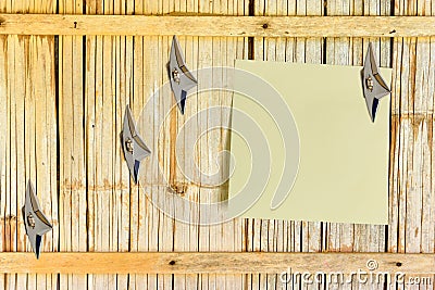 Blank piece of paper attached on an old house bamboo wooden wall. Stock Photo