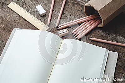 Blank daily planner notebook with pencils, pencil sharpener, ru Stock Photo