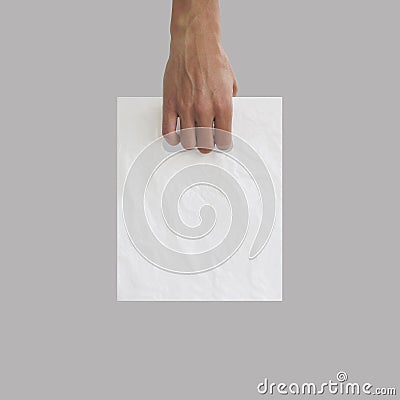 Blank plastic bag mock up holding in hand. Empty polyethylene pa Stock Photo