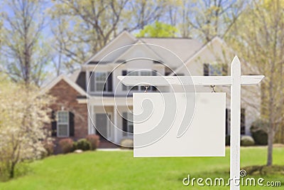 Blank Real Estate Sign in Front of New House Stock Photo