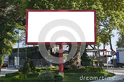 Blank red billboard on blue sky background for new advertisement in city Stock Photo