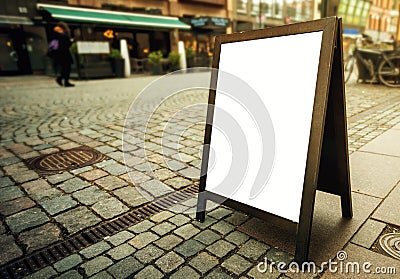 Blank restaurant advertising board as copy space on the street Stock Photo