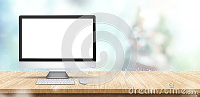 Blank screen computer desktop on wooden table with abstract blur Stock Photo