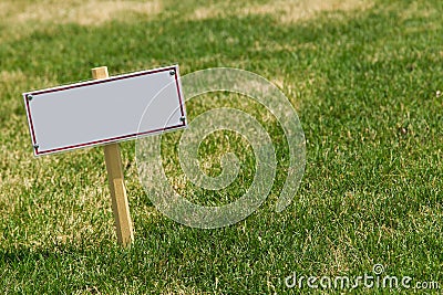 Blank sign on green grass Stock Photo