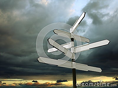 Blank signpost over dramatic sky Stock Photo