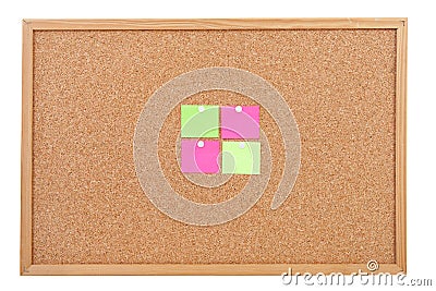 Blank sticky notes pinned on cork memo board Stock Photo