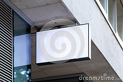 Blank store signboard mockup. Empty shop signage template mounted on the wall. Street sign, 3d rendering. Stock Photo