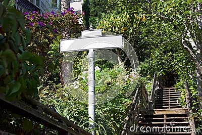 Blank street sign on secluded stairway Stock Photo