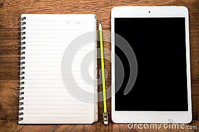 Blank tablet with an empty folder on a wooden workspace Stock Photo