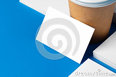 Blank takeaway coffee cup and white businesscards Stock Photo
