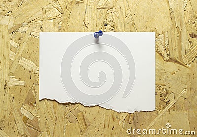 Blank torn paper frames, reminder pin with colored push pins to wooden wall Stock Photo