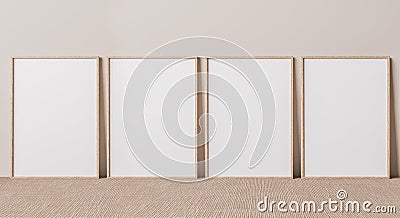 Blank vertical poster frame mock up standing on beige floor. Four wooden frames isolated in Scandinavian interior Stock Photo