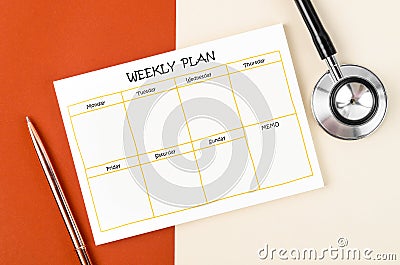 The Blank weekly plan notice block and medical stethoscope on beautiful background Stock Photo