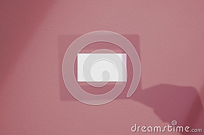 Blank white business card with frame in hand shadow overlay. Modern and stylish brand card mock up. Stock Photo
