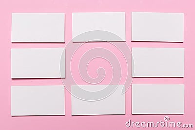 Blank white business cards on pink background Stock Photo