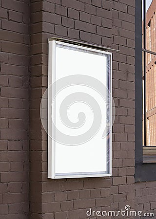 Blank white glass rectangular poster mockup brick wall mounted Stock Photo