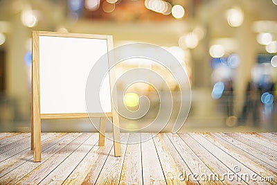 Blank white restaurant blackboard on wooden floor Stock Photo