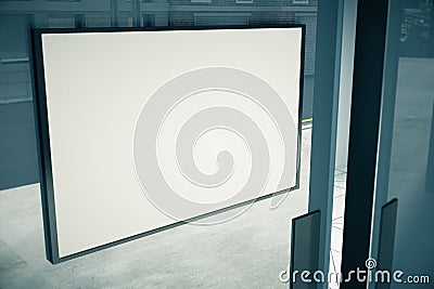 Blank white signboard on glassy door of building Stock Photo