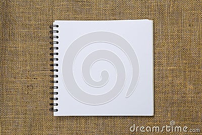Blank white sketch book on hessian texture background Stock Photo