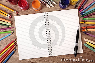 Blank white writing book open on school desk, pen, pencils, copy space Stock Photo