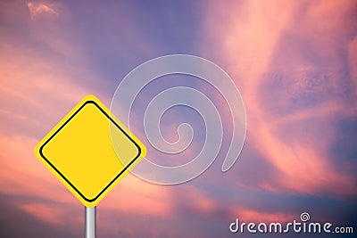 Blank yellow diamond transport sign on purple and pink sky Stock Photo