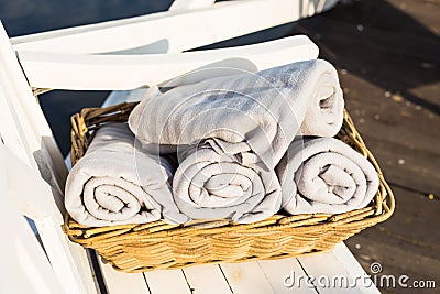 Blankets or towels in wicker basket outdoors Stock Photo