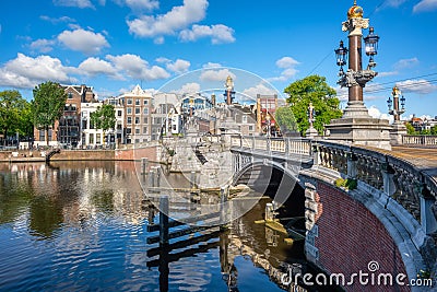 Blauwbrug and Amstel river in Amsterdam city, Netherlands Stock Photo