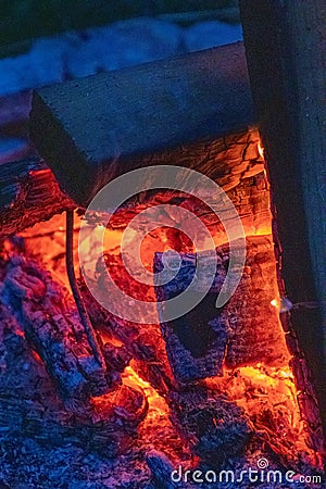 The blaze of an almost extinguished fire Stock Photo