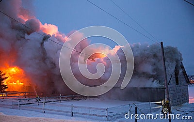 Blazing fire destroyed barn Stock Photo