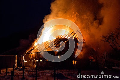 Blazing fire destroyed barn Stock Photo