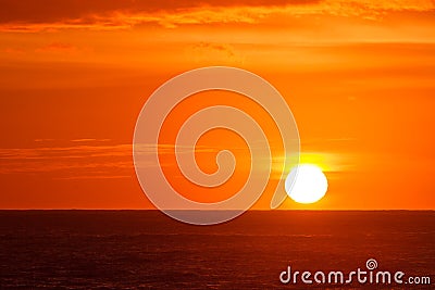 Blazing orange sunrise over seas Stock Photo