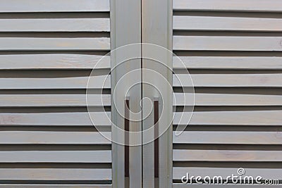 Bleached blue jalousie doors Stock Photo