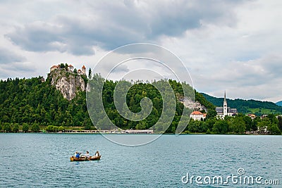 Bled castle with boat and lake in Slovenia Editorial Stock Photo