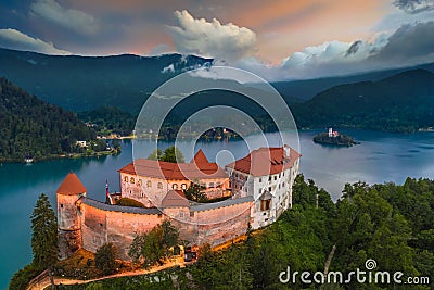 Bled, Slovenia - Aerial view of beautiful illuminated Bled Castle Blejski Grad with the Church of the Assumption of Maria Stock Photo