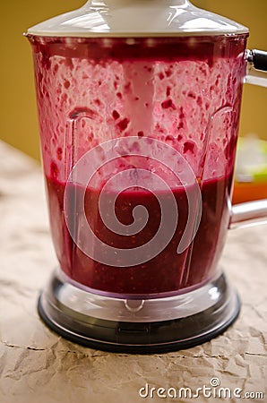 Blending raspberry puree Stock Photo