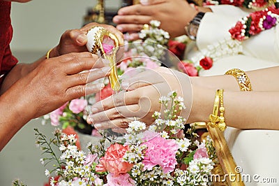 Blessed water at Thai wedding ceremony Stock Photo